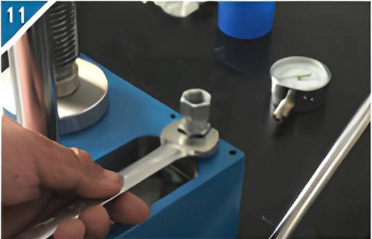 11. Remove the pressure gauge connecting column.