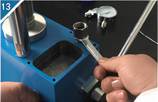 13. Install the pressure gauge connecting column.