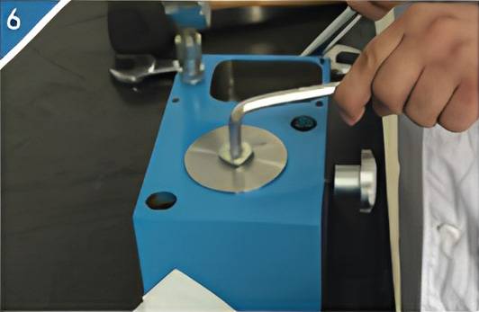6. Install the large oil cylinder lock nut.