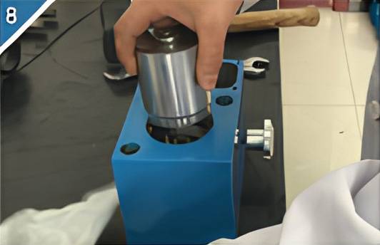 8. Remove the large oil cylinder.
