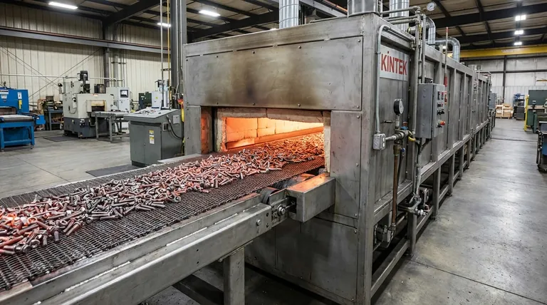 ما هو فرن الحزام الناقل؟ تحقيق معالجة حرارية عالية الحجم للأجزاء الصغيرة