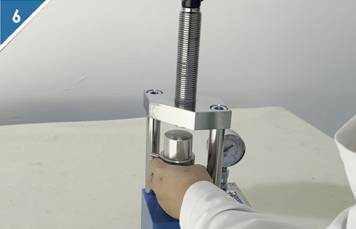 Remove the pressed mold from the tablet press